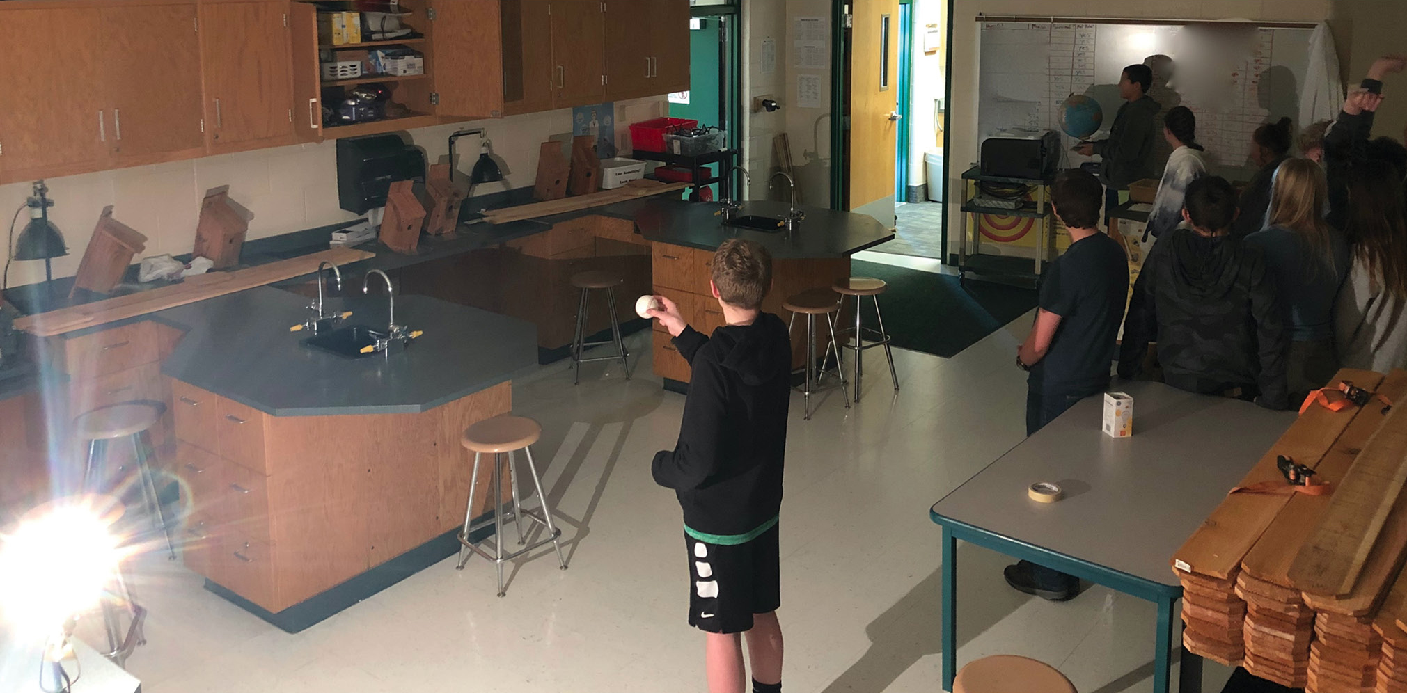 |	FIGURE 2: Students modeling eclipses in their classroom. 